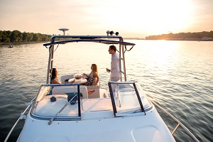 couple on a boat at sunset